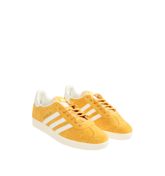 Image 2 of 5 - YELLOW - Adidas Classic Gazelle Sneakers are a lace-up style with satin uppers, suede and synthetic overlays, and gum outsoles. Textile linings.  