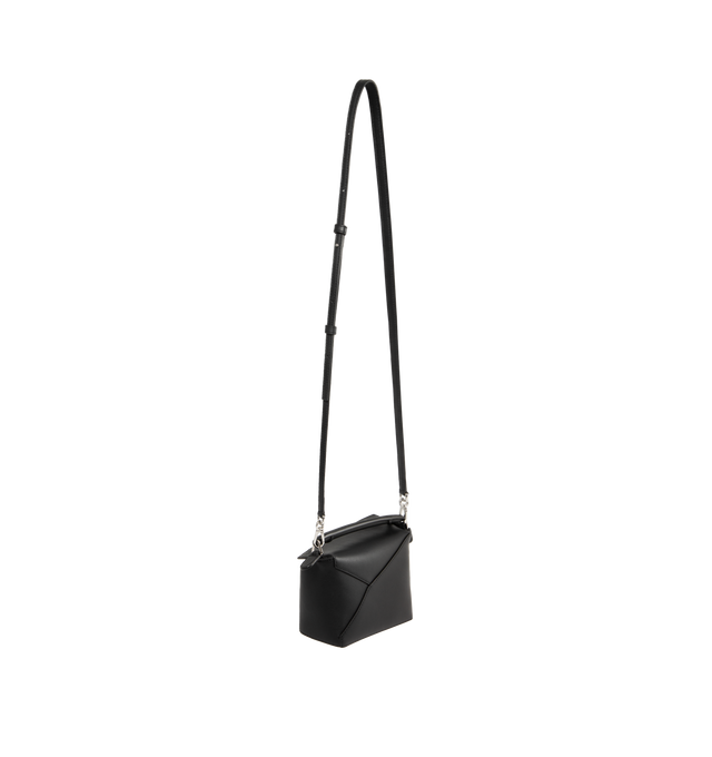 Image 2 of 3 - BLACK - LOEWE Puzzle Edge Mini Bag featuring leather shoulder bag with signature puzzle-piece stitching, rolled top handle, detachable, adjustable shoulder strap and zip top with covered flap. Approx. 2.5"H x 13.3"W x 1.4"D. Made in Spain. 