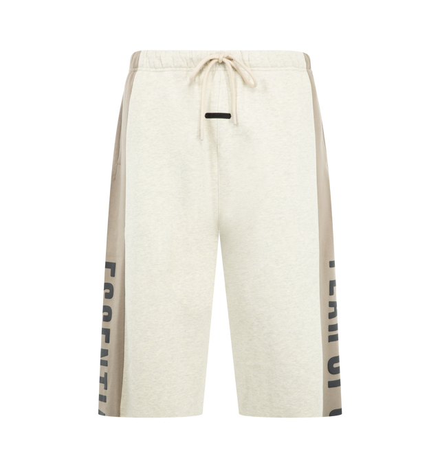 Image 1 of 4 - NEUTRAL - Fear of God Essentials Mens Sweatpants are crafted from heavyweight 380 GSM cotton-blend core fleece. Feature a wide-leg fit, paneled construction, elasticized waistband with bungee drawcord, side-seam pockets, raw-cut hem, puff-printed Fear of God and Essentials branding, and an Essentials logo label. Main Material: 80% Cotton, 20% Polyester.  