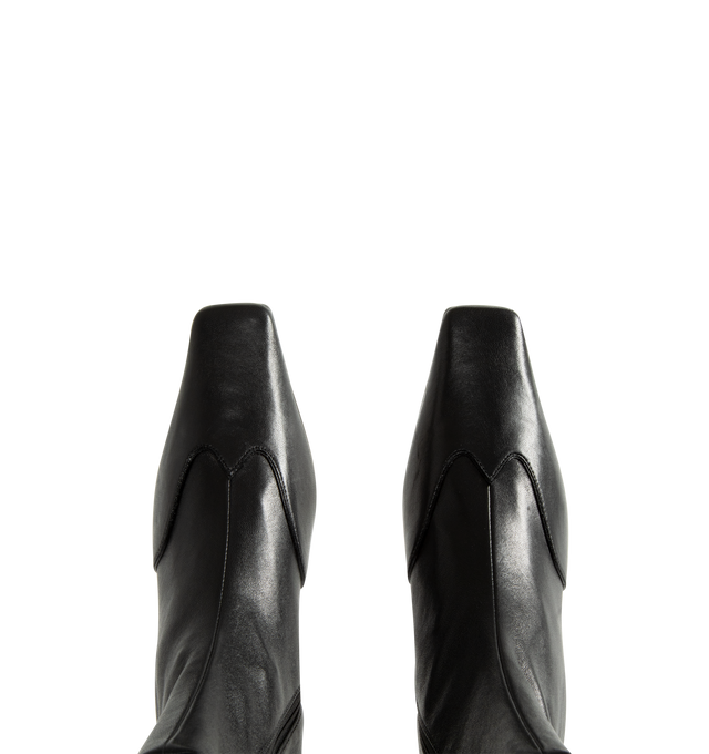Image 4 of 4 - BLACK - Khaite Women's Nevada Stretch Low Boot featuring mid-calf urban cowboy boot, calfskin wingtip traced by tonal topstitching, pointed toe and side zipper closure. Heel Height: 1.8 in. 100% lambskin. Made in Italy.  