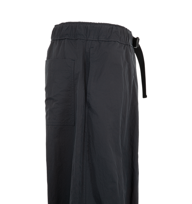 Image 3 of 3 - BLACK - Studio Nicholson Men's Caro Belted Pant is crafted from lightweight, water-repellent technical fabric and features a relaxed silhouette with an elasticated belted waistband and adjustable drawcord hems. Designed for versatile transeasonal wear, the crisp polyamide construction offers lightweight structure and everyday functionality, while the adjustable hems allow the shape to be customized for a more tapered fit. Main Material: 100% Polyamide. Made in Portugal. 