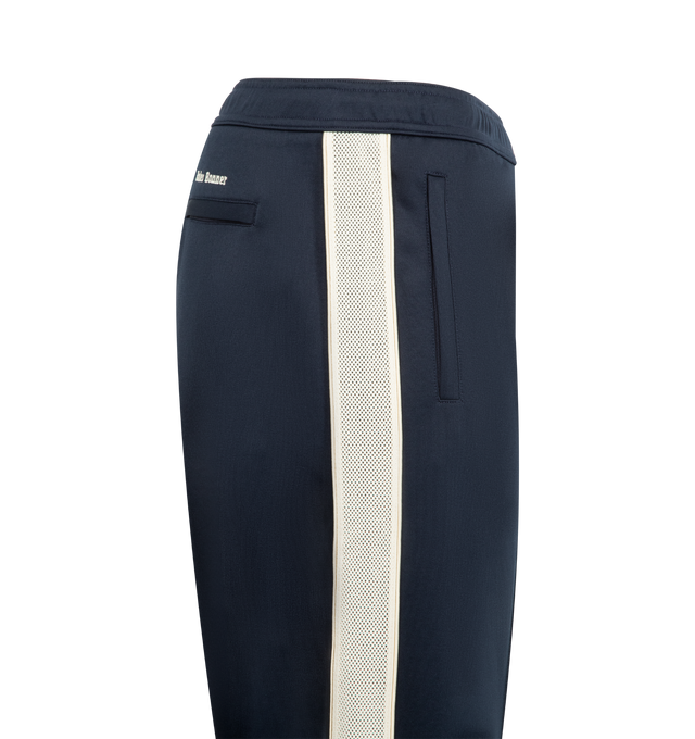 Image 3 of 3 - NAVY - WALES BONNER Motion Sweatpants featuring striped down side, drawstring fastening, 2 side slip pockets, back welt pocket and straight fit. 55% polyester, 45% cotton. 