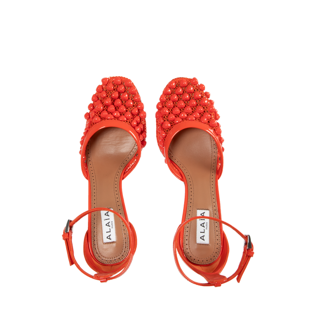 Image 4 of 5 - ORANGE - Alaia Fishnet Stud Pumps have pyramid studs embedded in mesh and adjustable ankle straps. 100% lambskin. Made in Italy.  