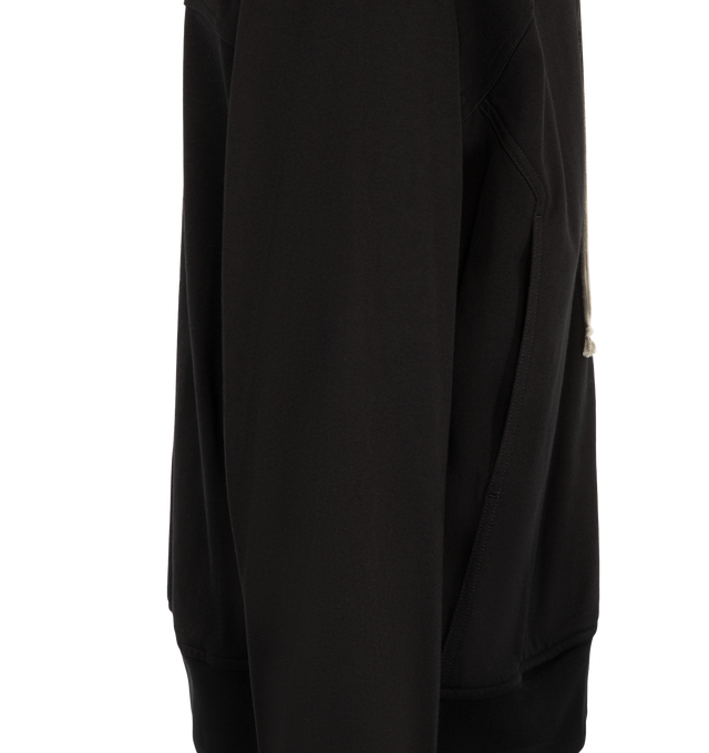 Image 3 of 3 - BLACK - Rick Owens Mens Windbreaker is crafted from heavyweight organic cotton jersey. Features a hip-length silhouette, hood with drawstring, front zip closure, raglan sleeves, front and back yoke, two side pockets with rounded topstitching, and ribbed cuffs and hem. Main Material: 100% Organic Cotton. Made in Italy. 