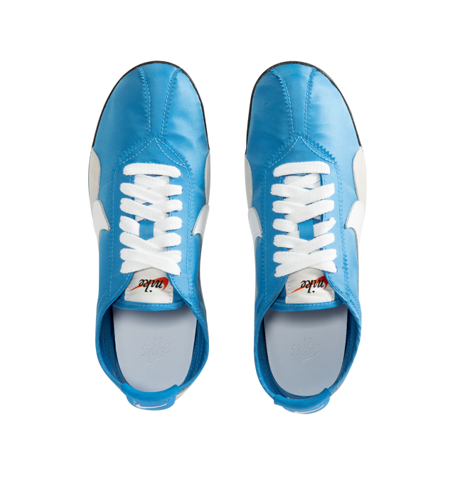 Image 5 of 5 - BLUE - Nike Men's Moon Shoe OG SP Sneakers feature an Italy Blue and Neutral Grey nylon upper with black and white accents and a leather Swoosh. Inspired by Nike's original 1970s running shoe, the streamlined silhouette is finished with a rubber Waffle outsole for durable traction. Upper: Nylon and Leather. Sole: Rubber. 