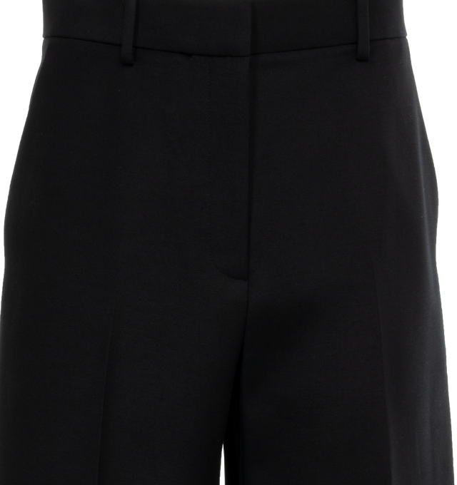 Image 4 of 4 - BLACK - KHAITE Bacall Pant featuring low waist, long-rise, tailored in softly structured suiting and added room in the leg for a more relaxed fit. 75% viscose, 25% polyamide. 