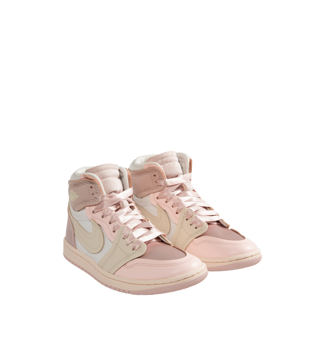 Image 2 of 5 - PINK - Women's Air Jordan 1 Method Of Make high top sneakers in Pink Oxford, Legend Light Brown, Atmosphere colorway inspired by pointe shoes playing with textures and proportions with satin details and exaggerated proportions including a larger Swoosh for a distinctive look. 