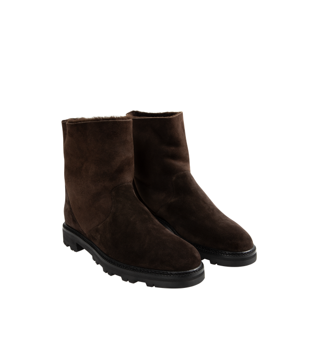 Image 2 of 4 - BROWN - MANOLO BLAHNIK Tomosa Boot featuring suede mid calf boots, shearling lining, pull on design and flat lugged rubber sole. Heel measures 10 mm. Upper: 100% kid suede. Sole: 80% rubber, 20% calf leather. Lining: 100% sheep leather. 