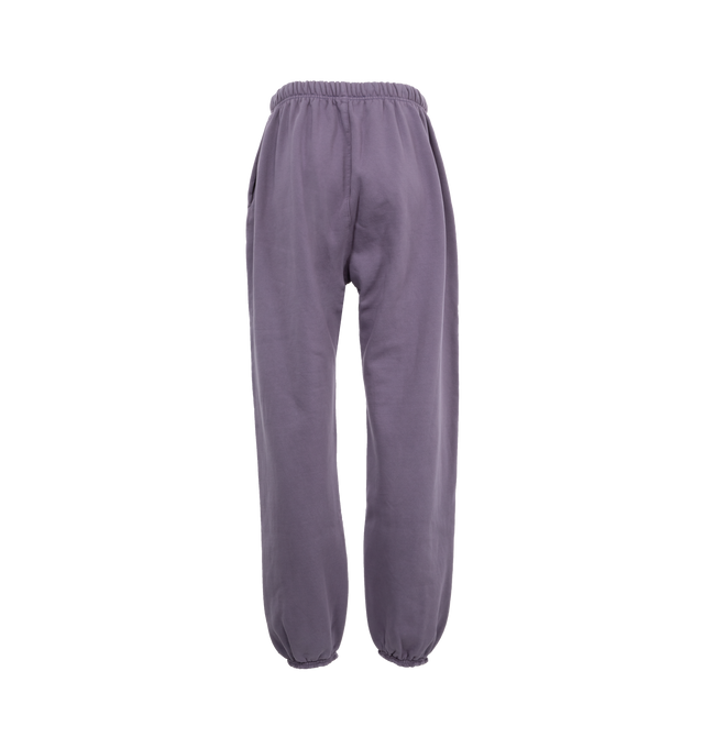 Image 2 of 3 - PURPLE - Fear of God Cotton Fleece Sweatpants (Womens) have an elastic drawstring waist, side seam pockets, elastic hems, and logo details. 83% cotton, 17% recycled polyester fleece.  