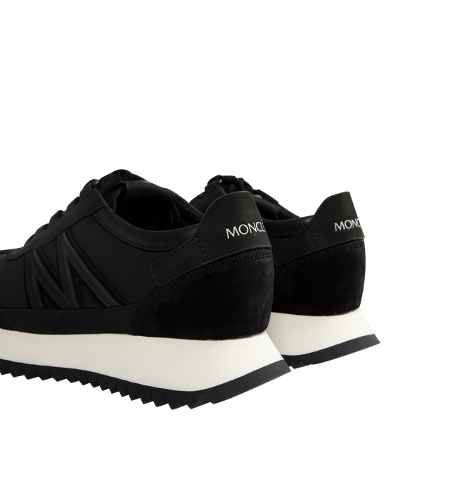 Image 3 of 5 - BLACK - Moncler Womens Pacey2 Sneakers feature a nylon, suede, and nubuck upper. Designed with a lace-up closure, mesh lining, padded construction, leather detailing, signature monogram accent, and TR outsole. Upper: Cow Leather and 100% Polyamide/Nylon; Lining: Cow Leather; Sole: 100% Elastodiene. Sole Height: 3.2 cm. Made in Vietnam. 
