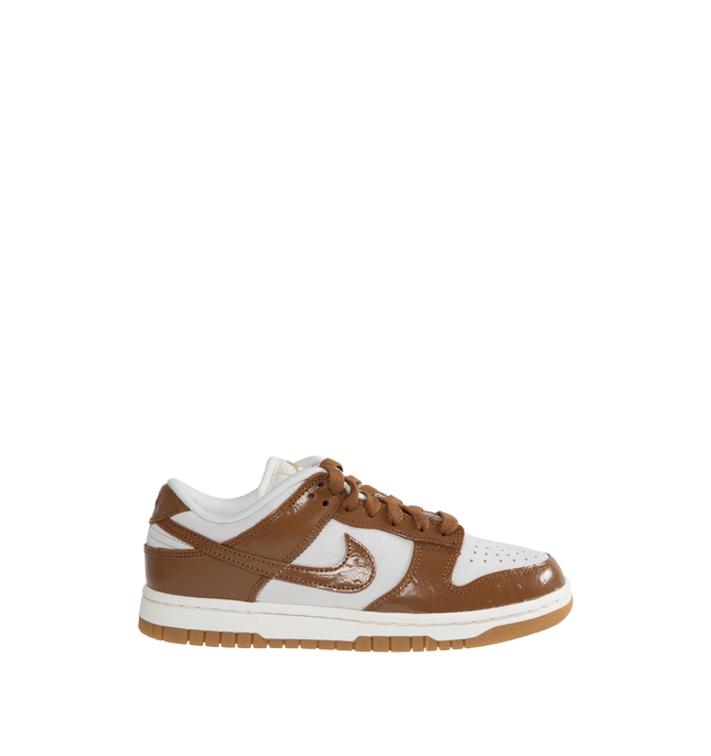 BROWN - NIKE Dunk Low LX Sneaker featuring lace-up front, signature Swooshes at sides, embossed Air logo at foxing, perforated toe and padded collar with debossed Nike logo at back counter.