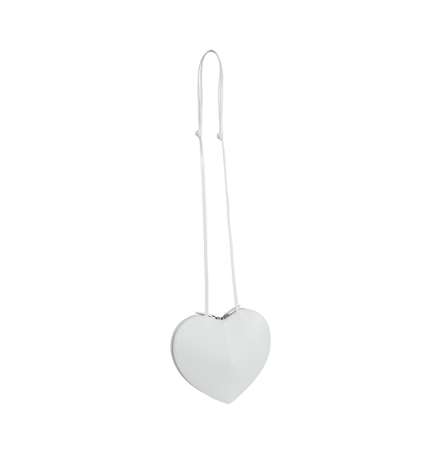 WHITE - ALAIA Le Coeur featuring heart shape, a simple cut in the leather creates volume and pure shape, zip closure and adjustable strap. L 21 X H 17 X D 5. 100% calfskin. Made in Italy.