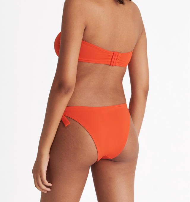 Image 5 of 6 - ORANGE - ERES Show Bandeau Bikini Top featuring bust shirring at front and sides, U-shaped metal link between cups, side stays and branded large back clasp. 84% Polyamid, 16% Spandex. Made in Italy. 