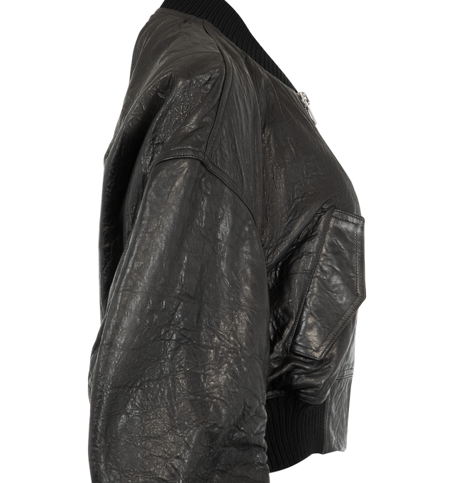 Image 3 of 3 - BLACK - Rick Owens Womens Secchia Flight Jacket is crafted from a textured leather material. Features an oversized fit, gathered long sleeves, ribbed collar, cuffs and hem, front zip closure, flap snap side pockets, two internal zip pockets, and full lining. Main Main Material: 100% Leather. Made in Italy. 