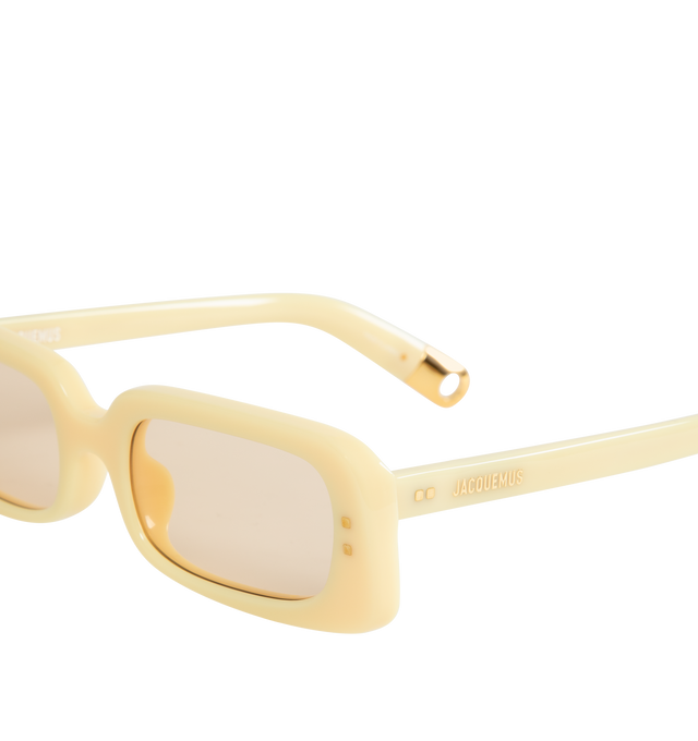 Image 3 of 3 - YELLOW - Jacquemus X Linda Farrow Rectangular Azzurro Sunglasses have yellow lenses, gold temple detailing, and acetate frames. 100% UV-protected solid lenses. Made in Italy.  