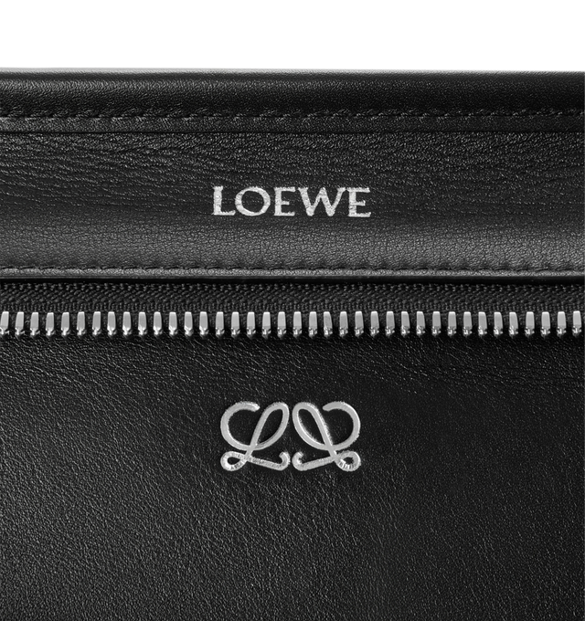 Image 12 of 14 - BLACK - Loewe Women's Medium Amazona 180 Bag is crafted from woven nappa calfskin and features a relaxed silhouette inspired by one of the house's iconic designs. Designed with a single Toron top handle and removable shoulder strap, it can be carried by hand, over the shoulder, or crossbody. A concealed magnetic closure, zip fastening with dual leather pullers, two compartments, an internal flat pocket, and a side D-ring provide functional organization. Finished with palladium-tone hardware 