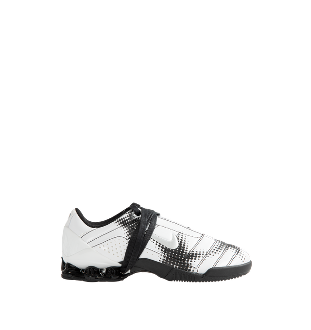 Image 1 of 5 - WHITE - Nike Women's Total 90 Shox Magia Sneakers feature a premium nubuck leather upper with oversized laces and printed graphic detailing, combining the iconic design of the Total 90 with a sleek, tonal finish. Inspired by early-2000s soccer style, these lifestyle sneakers pair signature Nike Shox cushioning with a durable rubber outsole for responsive comfort and everyday wear. Main Material: Nubuck Leather. Midsole: Nike Shox. Sole: Rubber.  