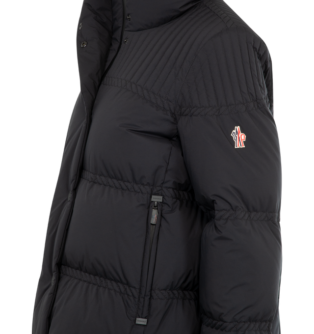 Image 3 of 3 - BLACK - MONCLER GRENOBLE Anglin Jacket featuring stand-up collar, front buttoned fastening, chest emrboidered logo, side zipped pockets, long sleeves, patch logo on the right sleeve, buttoned cuffs, straight hem and padded design. 100% polyamide/nylon. Padding: 90% down, 10% feather. Made in Romania. 