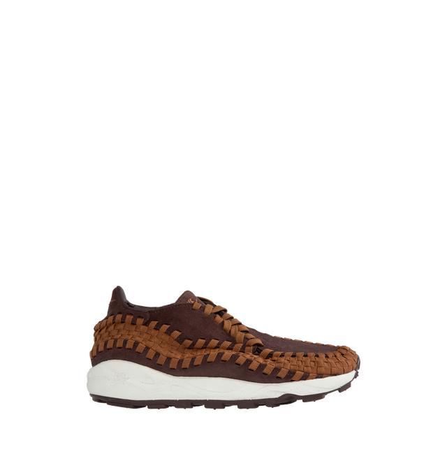 BROWN - NIKE Air Footscape Woven featuring suede upper, asymmetrical woven details, lateral lacing, foam midsole, Nike Air cushioned heel and rubber outsole.