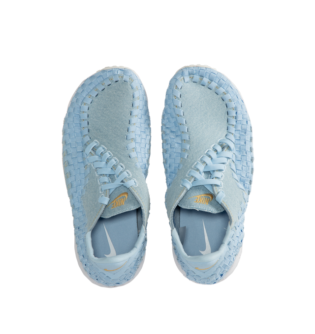 Image 5 of 5 - BLUE - NIKE Air Footscape Woven Sneakers featuring a pale blue colored textile and soft suede upper, asymmetrical woven details, lateral lacing, foam midsole, Nike Air cushioned heel and rubber outsole. 