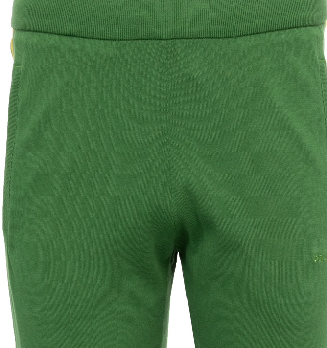 Image 4 of 5 - GREEN - ADIDAS X WALES BONNER Knit Track Pants featuring elastic waistband and cuffs at hem, logo details and two front pockets. 100% cotton. 