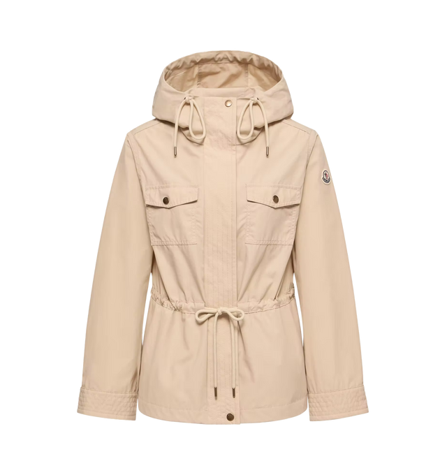 Image 1 of 1 - NEUTRAL - Moncler Serin Hooded Cotton Blend Parka is a lightweight design offering effortless sophistication for transitional wear. Crafted from a cotton-blend fabric with crisp texture and a fluid drape, this style reimagines the classic parka with a refined, modern silhouette. Features adjustable hood, front closure, and functional pockets for everyday practicality. Exterior: 51% polyester, 49% cotton. Made in Moldova. 