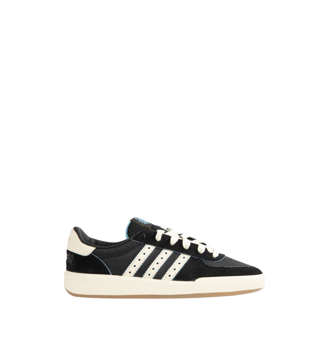 Image 1 of 5 - BLACK - Adidas Mens Glenburn x Thrasher Sneaker is crafted from suede and leather with a rubber sole. Features a lace-up closure, padded tongue with logo patch detail, padded low-cut collar, signature stripes with perforated trim, almond toe, and includes spare laces. Suede and leather upper with rubber sole. Made in Vietnam. 
