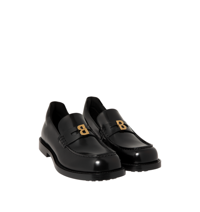 Image 2 of 4 - BLACK - Balenciaga Womens Comfy Loafers are crafted from smooth moka leather. Feature a slip-on silhouette, round toe, metallic detail across the vamp, thick sole, and leather construction designed to develop a natural patina over time. Main Material: Leather; Sole: Leather. Made in Italy. 