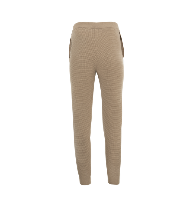 Image 2 of 3 - NEUTRAL - Fear of God Essentials Women's waffle knit fitted sweatpants in a pull-on style featuring side slit pockets, drawstring, and Essentials Fear of God rubberized label at the center front.  88% polyester, 12% nylon. 