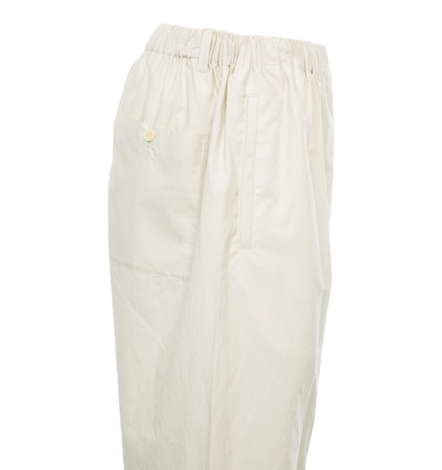 Image 3 of 4 - NEUTRAL - LEMAIRE Poplin pants in a straight leg fit crafted from a silk-cotton blend featuring belt loops, two side welt pockets, rear patch pocket,  elasticated waistband with internal drawstring.  Unisex style in standard men's sizing. Outer: Cotton 80%, Silk 20%, Lining: Cotton 100%. 