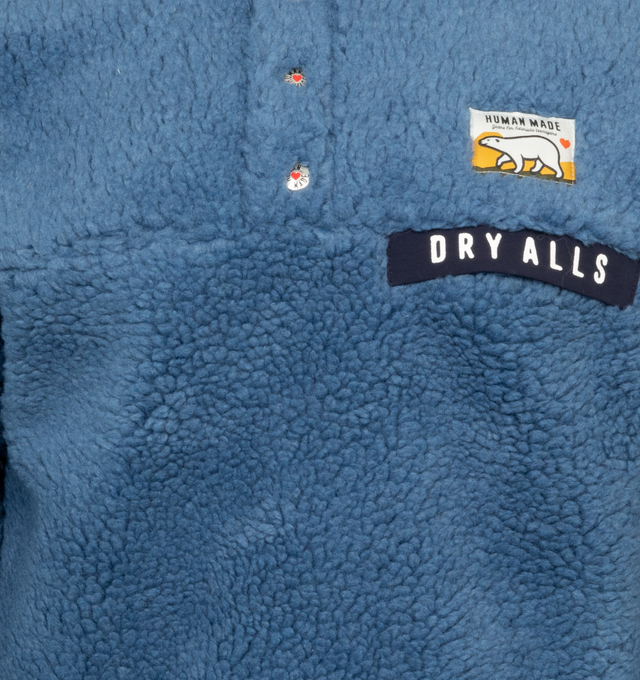 Image 3 of 4 - BLUE - HUMAN MADE Boa Fleece Pullover featuring stand collar, 4 button closure, ribbed cuffs and hem, patch logo on chest and logo on back.  