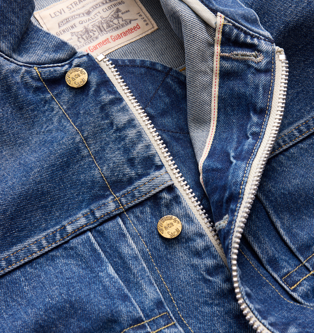 Image 4 of 4 - BLUE - Sacai X Levi's Women's Denim Jacket are crafted from a medium wash cotton denim featuring a deconstructed denim design with a central zipper and utility pocket details on the sleeve. Main Material: 100% Cotton. Made in Japan. 