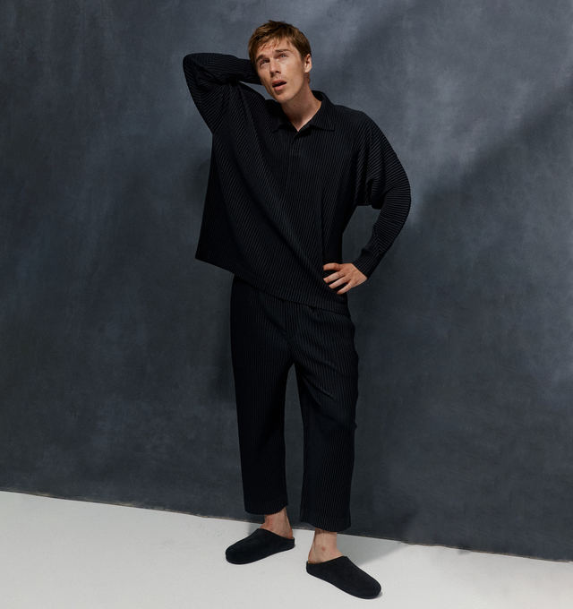 Image 2 of 4 - BLACK - Issey Miyake Basic Pants have an elastic waist with a mock fly, belt loops, side pockets, and signature pleated fabric. 100% polyester.  