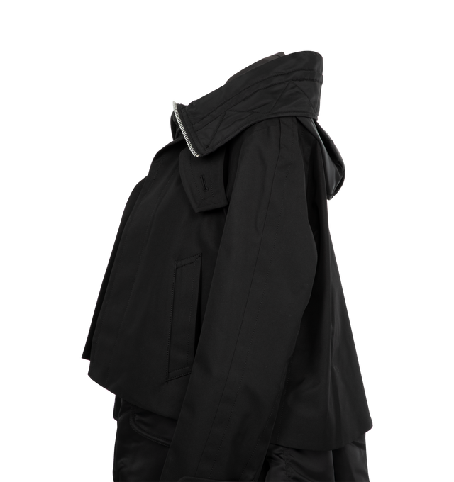 Image 3 of 3 - BLACK - SACAI Cotton Gabardine Blouson featuring layered construction, a nylon asymmetrical design with a stand collar, a drawcord hood, long sleeves and button-front closure. 63% cotton, 37% polyester. Combo: 100% nylon. Made in Japan. 
