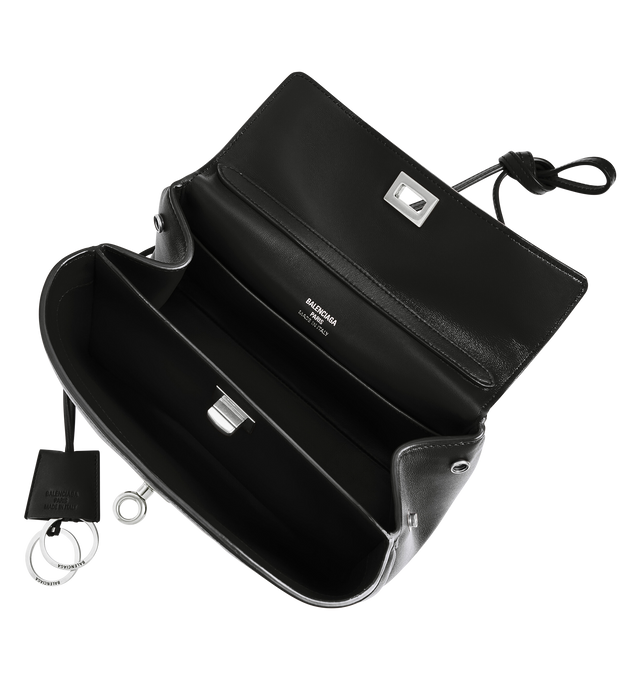 Image 5 of 5 - BLACK - BALENCIAGA Rodeo Handbag Mini featuring smooth calfskin, one handle hand carry, removable crossbody strap, removable cloche cls with two split rings, aged-silver hardware, turn lock closure, wide front pocket, 1 main compartment, 2 flat pockets at back, side snaps, 4 brass feet and nappa lambskin lining. 9" x 6.7" x 3.9". Calfskin. Made in Italy.  