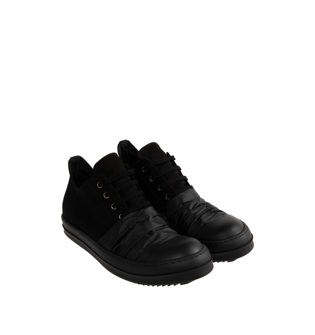 Image 2 of 5 - BLACK - Rick Owens DRKSHDW Hustler Low Sneaks Sneakers featuring cap toe, lace-up closure, extended tongue, eyelets vents at inner side and treaded rubber sole. Upper: textile. Sole: rubber. Made in Italy. 