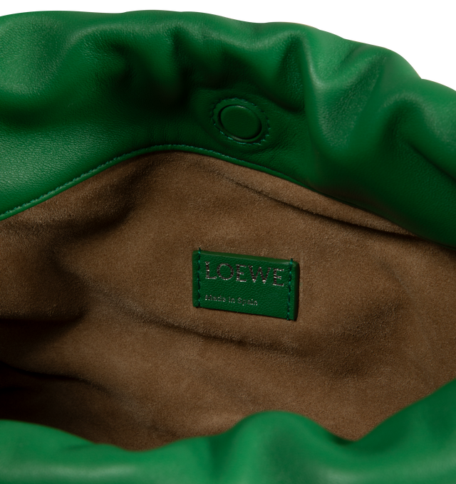 Image 4 of 4 - GREEN - LOEWE Flamenco Purse crafted in mellow nappa lambskin in a ruched design featuring knots at the sides, magnetic closure and detachable donut chain. Versatile and functional, it can be carried as a clutch, worn over the shoulder using the donut chain or crossbody with the accompanying leather strap.  Nappa leather with suede lining. Height 7.9" X Width 11.8" X Depth 4.1". Adjustable Strap length (inches) 37" to 47". Made in Spain. 