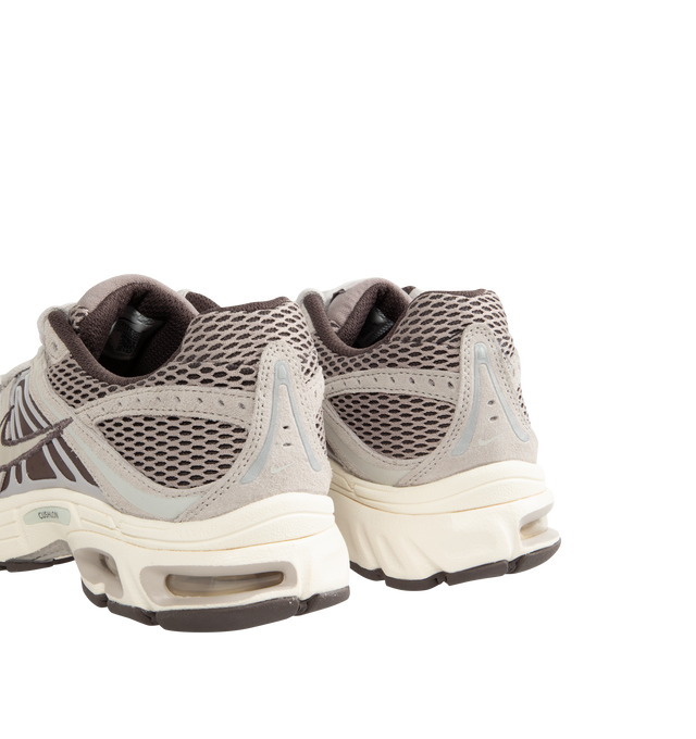 Image 3 of 5 - NEUTRAL - Nike Air Max Moto 2K Men's Sneakers feature a layered upper crafted from synthetic leather and textile with metallic accents for a modern, Y2K-inspired look. These performance-inspired lifestyle sneakers combine Max Air cushioning, a lightweight foam midsole, and a durable rubber outsole for all-day comfort and reliable traction. Main Material: Synthetic Leather and Textile. Midsole: Foam. Sole: Rubber. 