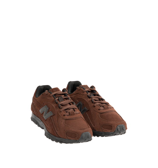 Image 2 of 5 - BROWN - New Balance 204L Sneakers feature an interpretation of 2000s running-inspired style, blending the slim proportions of vintage 1970s running shoes with modern technical detailing. Crafted with a premium suede upper, this low-profile silhouette draws inspiration from iconic New Balance designs past and present, resulting in a look that feels both familiar and contemporary. Distinctive arced overlays, screen-printed saddle graphics, and a double-stacked suede "N" logo add visual depth, 