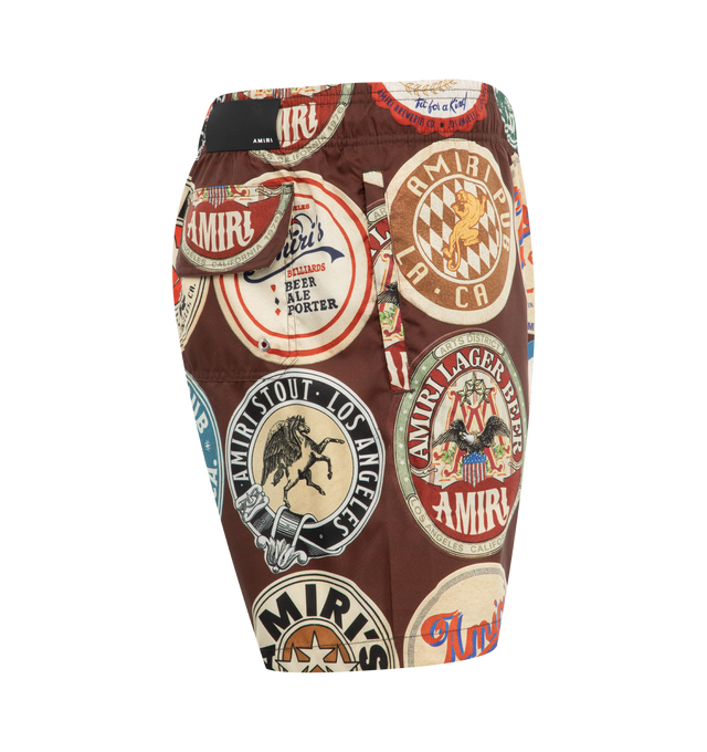 Image 3 of 3 - BROWN - Amiri Coasters Swim Trunks have an elastic drawstring waist, a graphic print design, and a back pocket. 100% polyester. Made in Bosnia.  