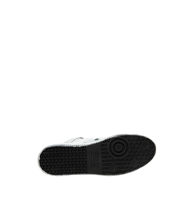 Image 4 of 5 - WHITE - MAISON MARGIELA Future Sneaker Bianchetto featuring calfskin, upper and sole are finished with our Bianchetto technique, white paint brushed across the surface to reveal the black leather beneath at the edges, hidden strap folds across the tongue and signature white stitch at the back. 