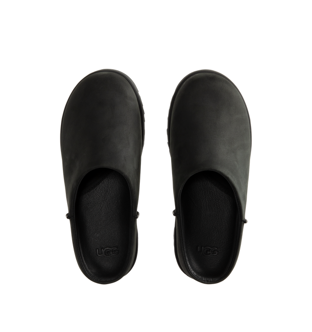Image 4 of 4 - BLACK - UGG women's Otzo Clog built with a luxe nubuck upper, thoughtful knit + leather lining, and a contoured footbed for steady movement. This clog has easy slip-on style with all-day comfort. Waterproof leather, nubuck upper, leather and wool jersey lining with peppermint-based anti-odor treatment. Contoured EVA footbed, lightweight rubber outsolewith embossed UGG logo. 