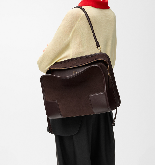 Image 3 of 16 - BROWN - LOEWE Large Amazona 180 Bag in suede featuring a relaxed silhouette anchored by a single toron top handle, designed to be carried open while a concealed closure secures the main compartment, removable shoulder and crossbody straps, zip closure with two leather zip pullers, two compartments, main compartment closed with magnetic closure, internal flat pocket, left side d-ring for customization, suede and nappa lambskin lining, embossed LOEWE and embossed double L branding. Suede/calf. 