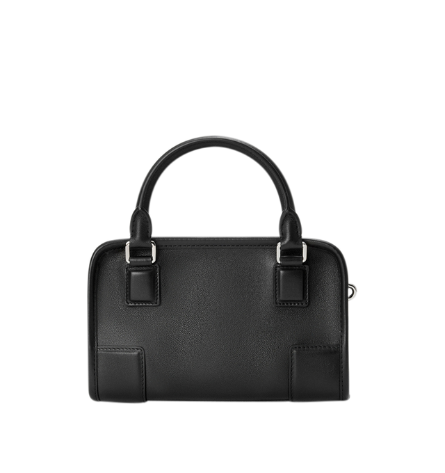 Image 5 of 11 - BLACK - Loewe Mini Amazona 180 Bag in leather features a relaxed silhouette anchored by a single toron top handle, designed to be carried open, while a concealed closure secures the main compartment, removable shoulder and crossbody straps, two carry options: short handle, removable and adjustable crossbody strap, zip closure with two leather zip pullers, two compartments, main compartment closed with magnetic closure, left side d-ring for customization, suede and nappa lambskin lining, and  