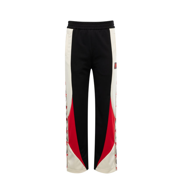 Image 1 of 3 - BLACK - PALM ANGELS Moneygram Haas F1 Team Track Pants featuring elastic waistband, monogram patch on front, colorblocking and stars down leg. 100% polyester.  