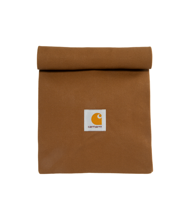 Image 1 of 6 - BROWN - CARHARTT WIP Lunch Bag featuring dry wax coating, food safe, snap button closure and square label. 14.5 x 7.9 x 4.7 inch. 100% cotton. 