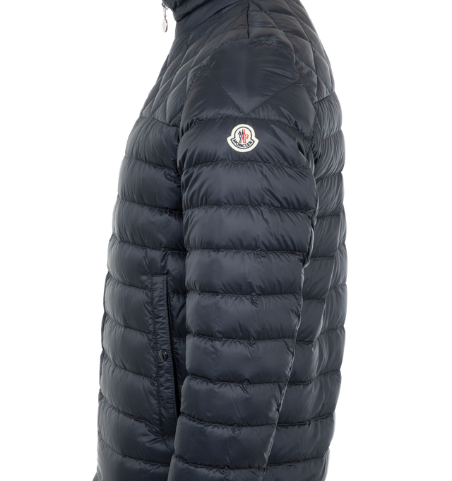 Image 5 of 6 - NAVY - Moncler Benamou Short Down Jacket has a mock neckline, a 2-way zip front closure, snap pockets and cuffs, a tricolor stripe placket, and diamond quilting details. Down and feather fill. 100% polyamide.  