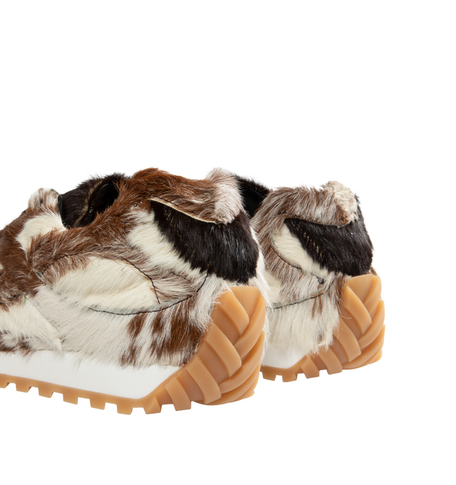 Image 3 of 5 - NEUTRAL - Bottega Veneta Orbit Goat Hair Sneakers are a lace-up style with goatskin hair for a unique patchwork effect, lambskin linings, and rubber soles. Made in Italy.  