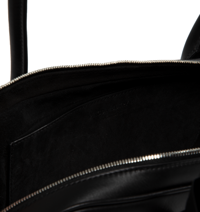 Image 3 of 3 - BLACK - MAGDA BUTRYM Brigitte bag in a trapeze shape. Inspired by the nostalgia of 90's with an elegant silhouette, roomy interior, two top handles, top zipper and leather flower embellishment  fixed onto the bag's handle.  Made in Italy. 100% Calf Leather exterior and interior. 