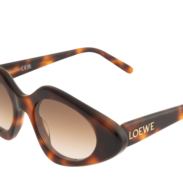 Image 3 of 3 - BROWN - LOEWE Triangle Slim Sunglasses featuring triangle-shaped sunglasses in a slim acetate construction, international fit, UVA/UVB protection and gold-finish metal LOEWE. Acetate. Made in Italy. 
